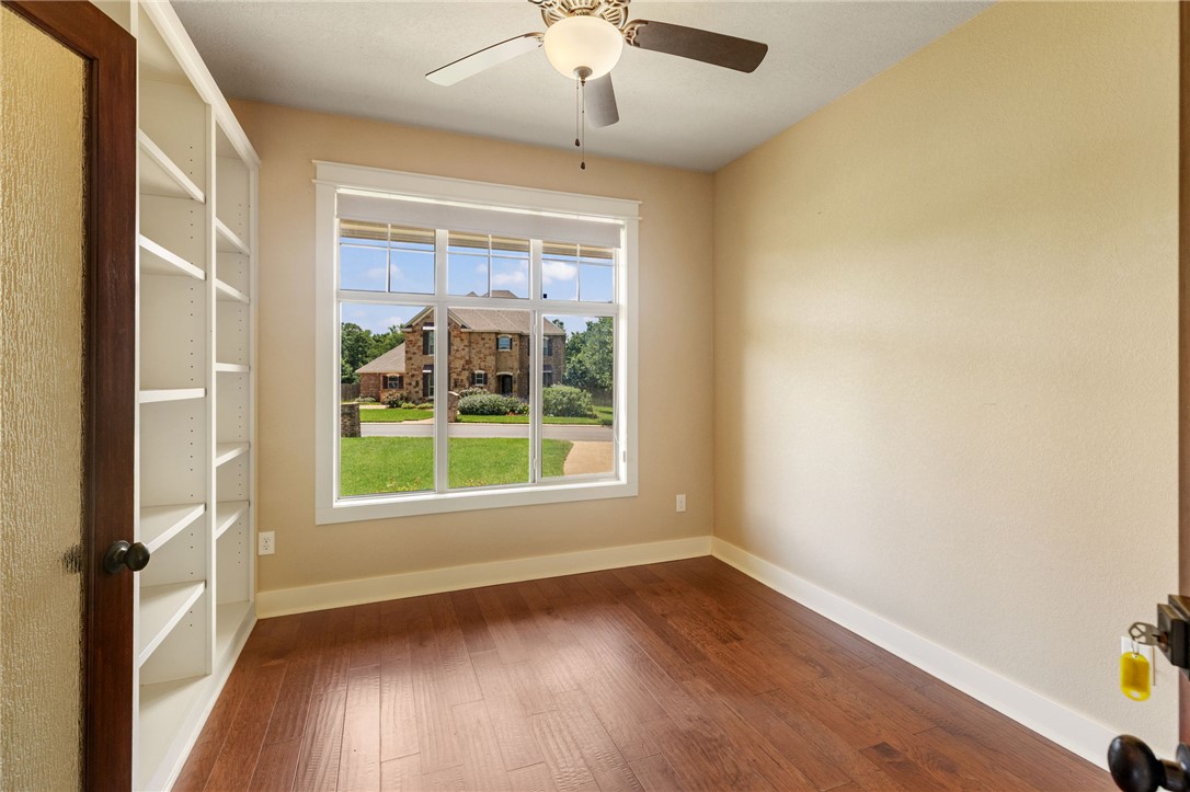 2136 Rockcliffe Loop College Station, TX 77845 - Photo 10 of 48 an empty room with wooden floor and windows