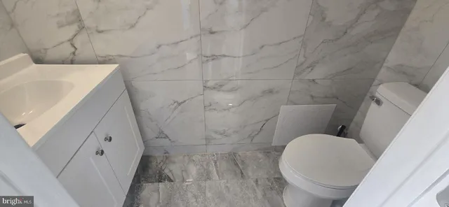 a bathroom with a sink and toilet