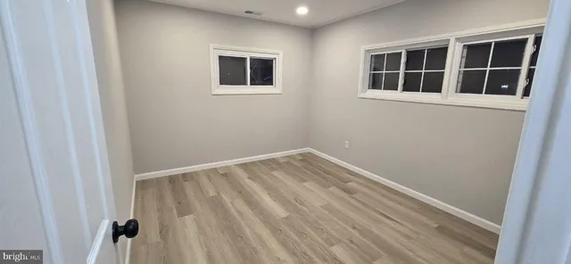 a view of empty room with windows