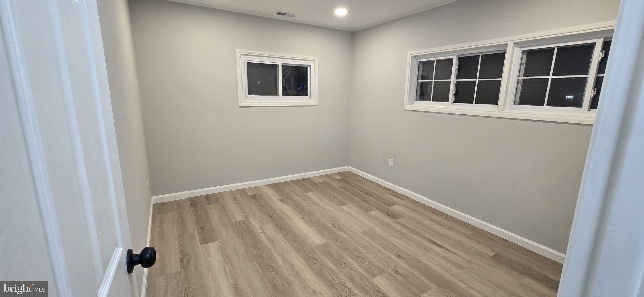 35 Beechtree Road Levittown, PA 19057 - Photo 13 of 20 a view of empty room with windows