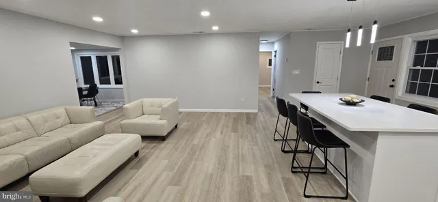 a living room with furniture and a table