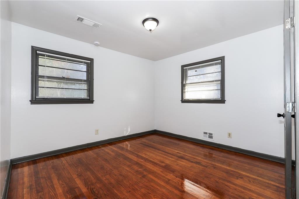 1678 Bagpipe Place Conley, GA 30288 - Photo 2 of 16 a view of a room with wooden floor and window