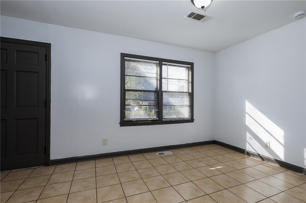 1678 Bagpipe Place Conley, GA 30288 - Photo 6 of 16 a view of an empty room and window