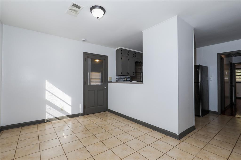 1678 Bagpipe Place Conley, GA 30288 - Photo 7 of 16 a view of a livingroom with wooden floor