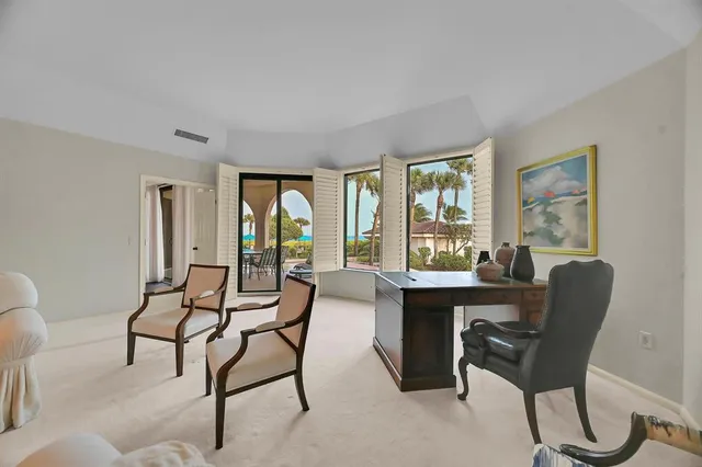 a dining room with furniture and chandelier