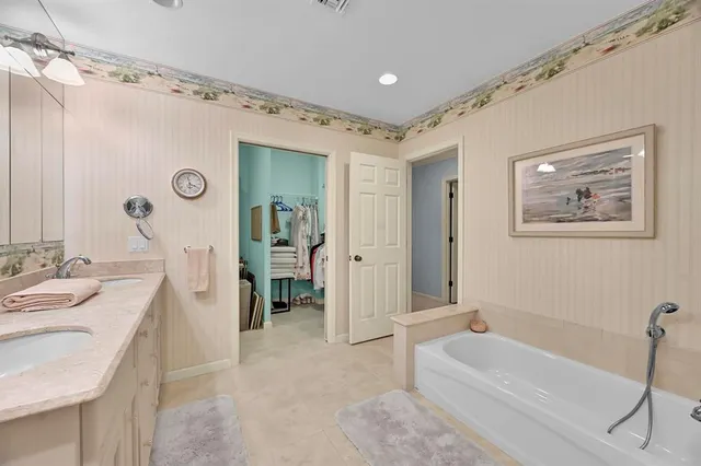 a bathroom with a granite countertop sink mirror and