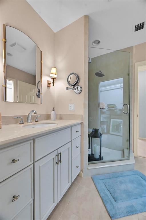 1171 North Ocean Boulevard, Unit 1A N Delray Beach, FL 33483 - Photo 25 of 41 a bathroom with a granite countertop sink mirror and