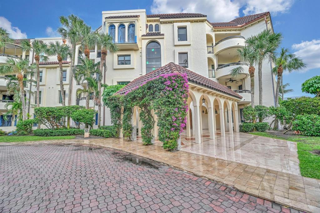 1171 North Ocean Boulevard, Unit 1A N Delray Beach, FL 33483 - Photo 4 of 41 a front view of a house with garden