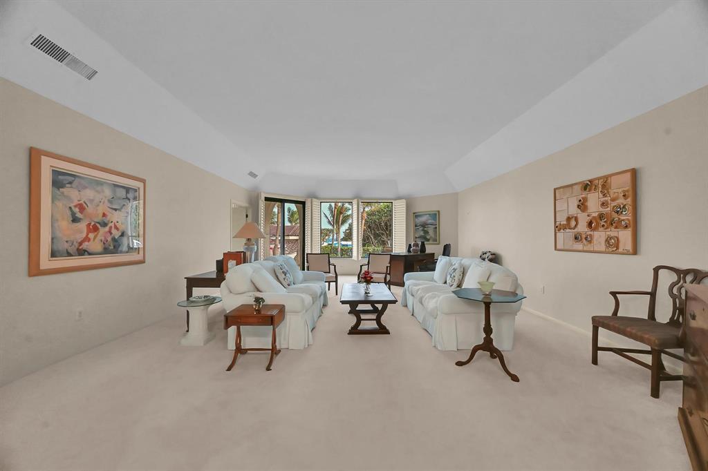 1171 North Ocean Boulevard, Unit 1A N Delray Beach, FL 33483 - Photo 7 of 41 a living room with furniture and a window