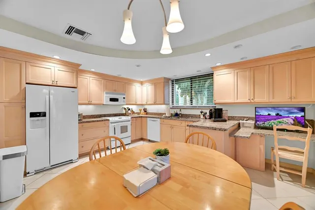 a kitchen with a sink cabinets and stainless steel appliances