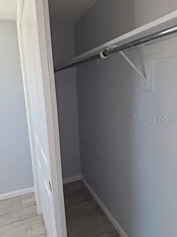 a view of an empty walk in closet