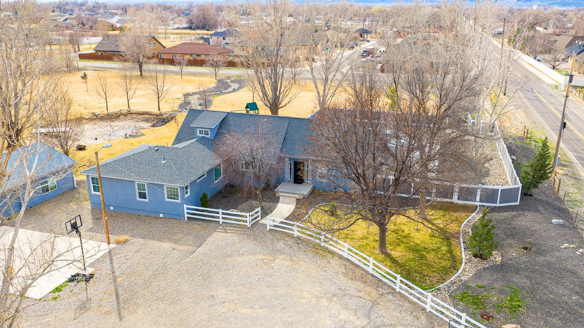 1166-17 17 1/2 Road Fruita, CO 81521 - Photo 1 of 42 a view of a swimming pool with a lounge chairs