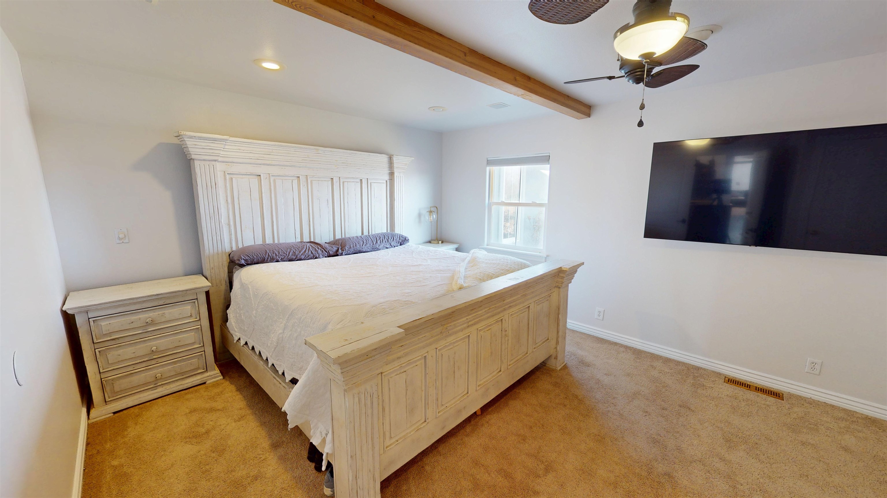 1166-17 17 1/2 Road Fruita, CO 81521 - Photo 13 of 42 a bedroom with a bed and a chandelier