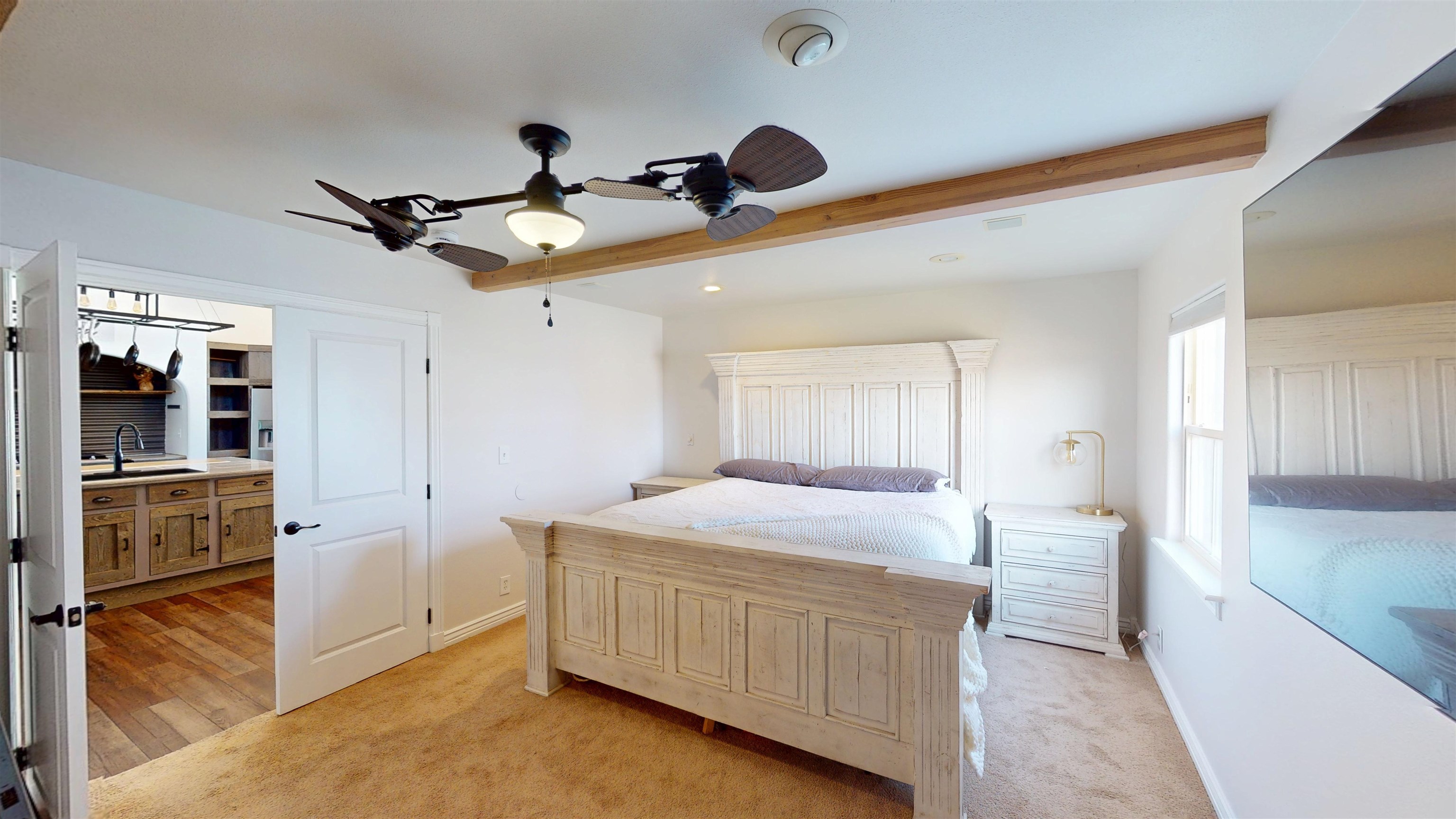 1166-17 17 1/2 Road Fruita, CO 81521 - Photo 15 of 42 a bedroom with a bed and a chandelier