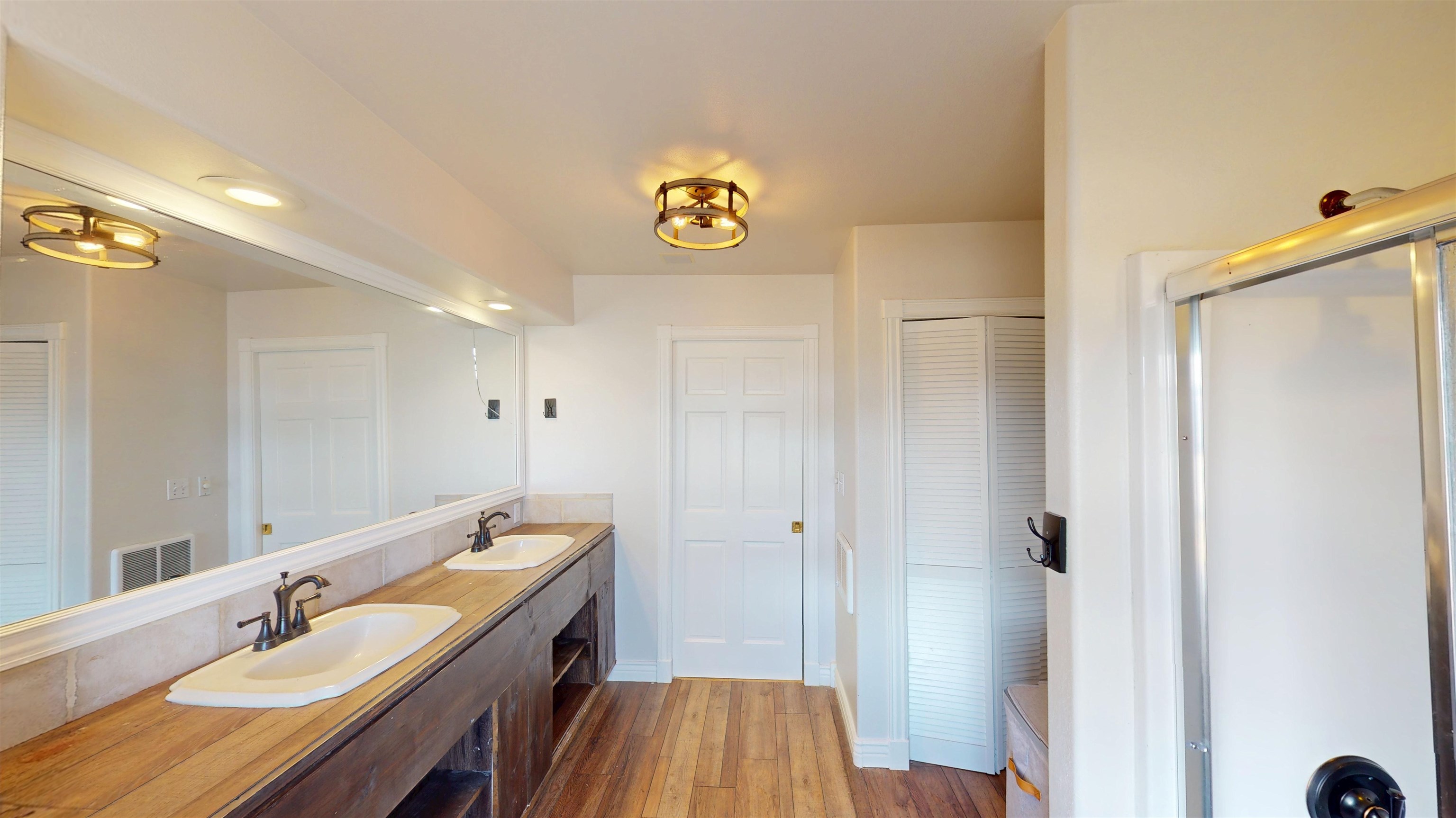 1166-17 17 1/2 Road Fruita, CO 81521 - Photo 17 of 42 a spacious bathroom with a sink a mirror and a shower