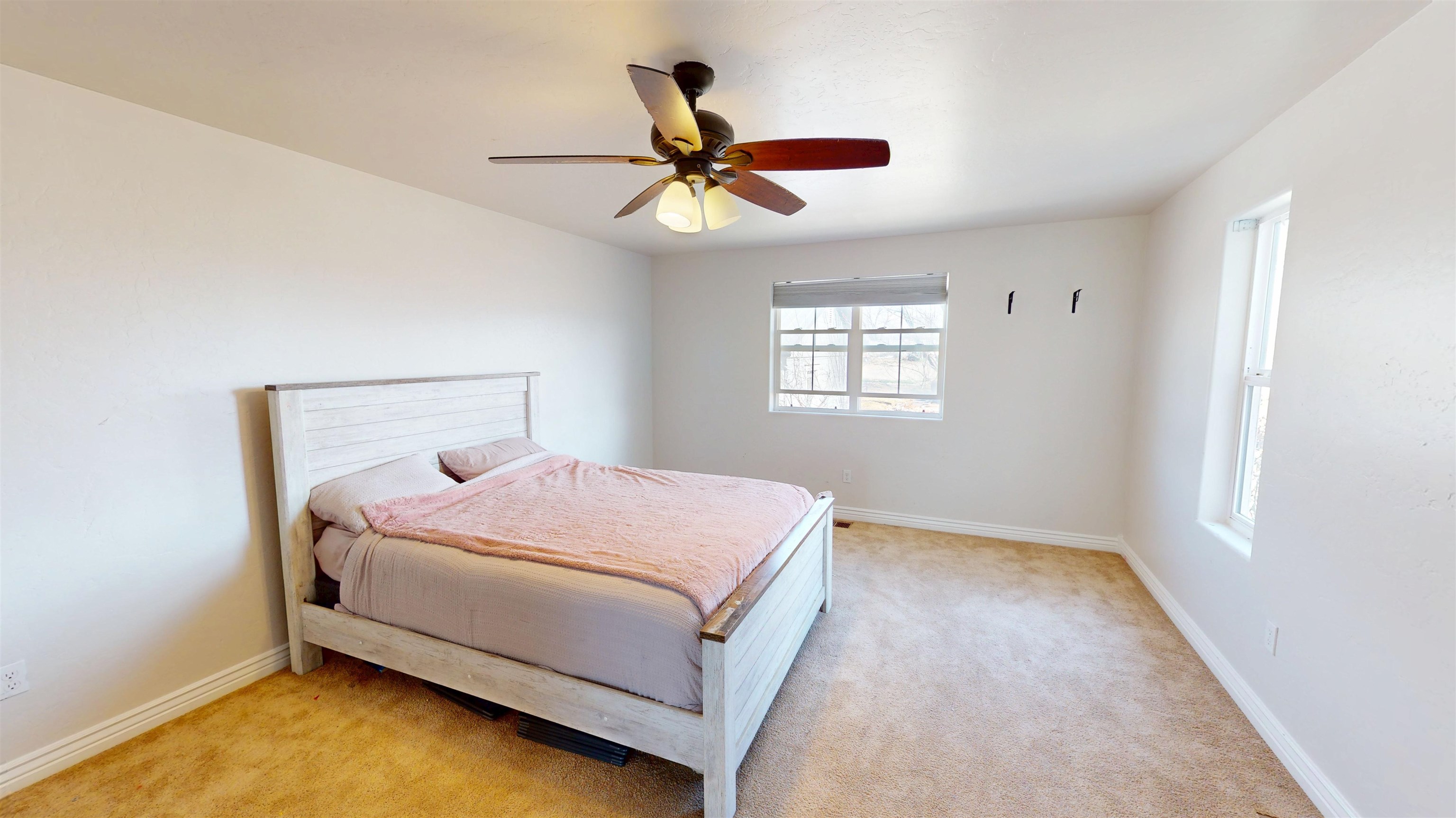 1166-17 17 1/2 Road Fruita, CO 81521 - Photo 18 of 42 a bedroom with a bed and window