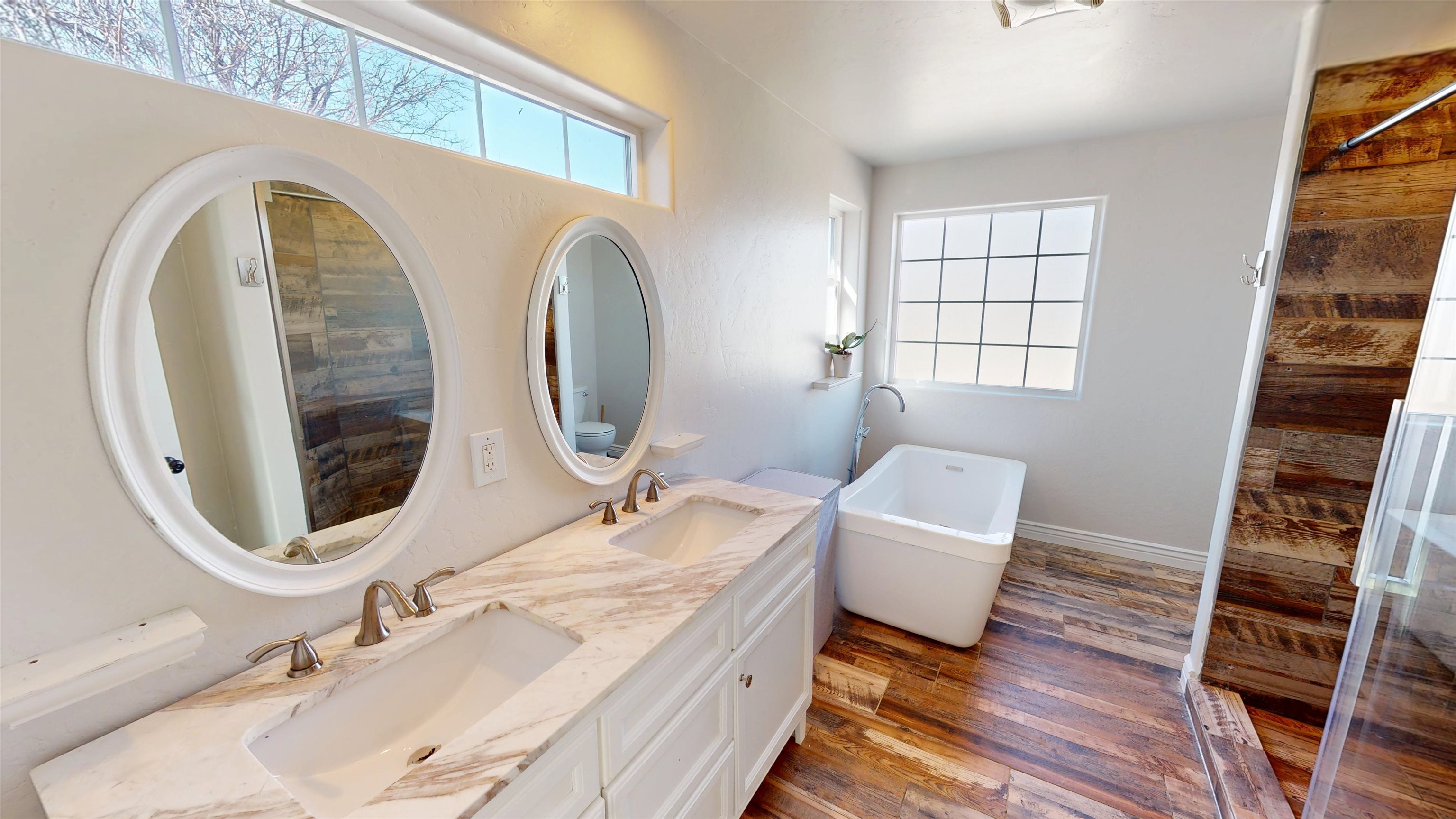 1166-17 17 1/2 Road Fruita, CO 81521 - Photo 19 of 42 a bathroom with a double vanity sink and a mirror