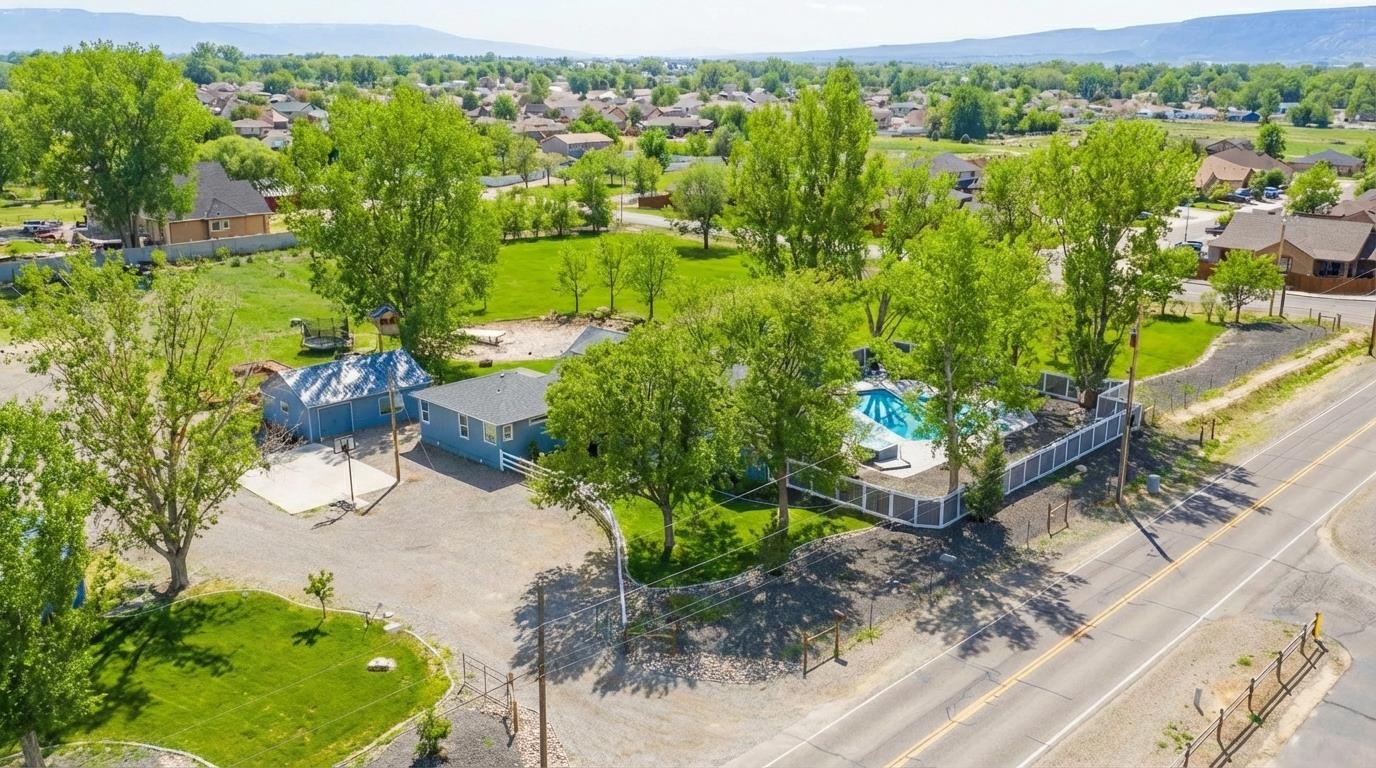 1166-17 17 1/2 Road Fruita, CO 81521 - Photo 2 of 42 an aerial view of a house with a yard