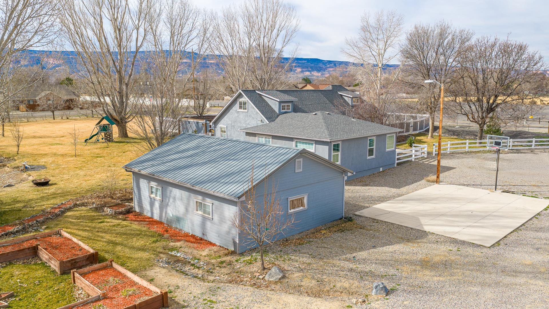 1166-17 17 1/2 Road Fruita, CO 81521 - Photo 25 of 42 a view of a house with a yard