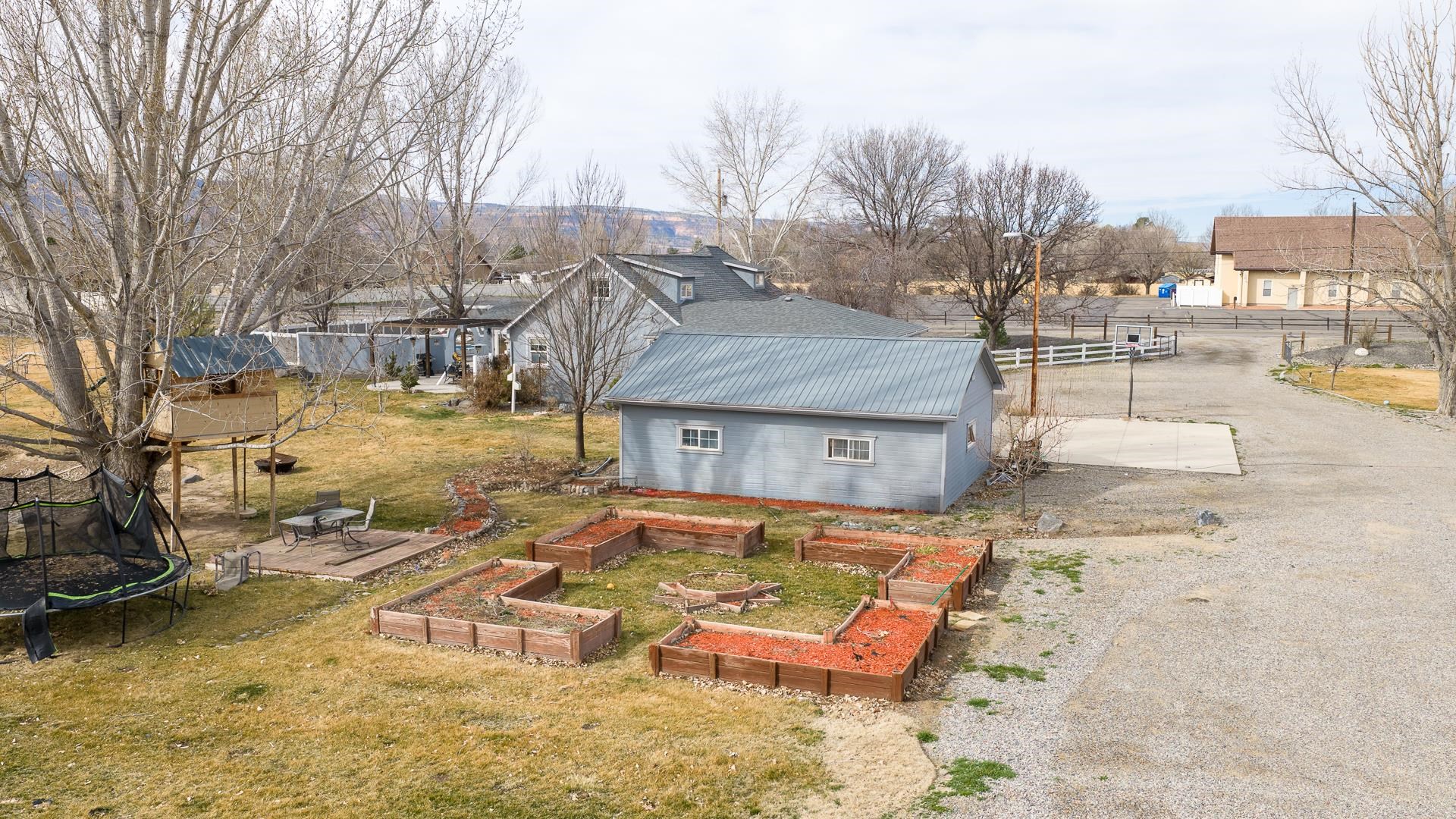 1166-17 17 1/2 Road Fruita, CO 81521 - Photo 27 of 42 a view of a house with a yard covered in the snow