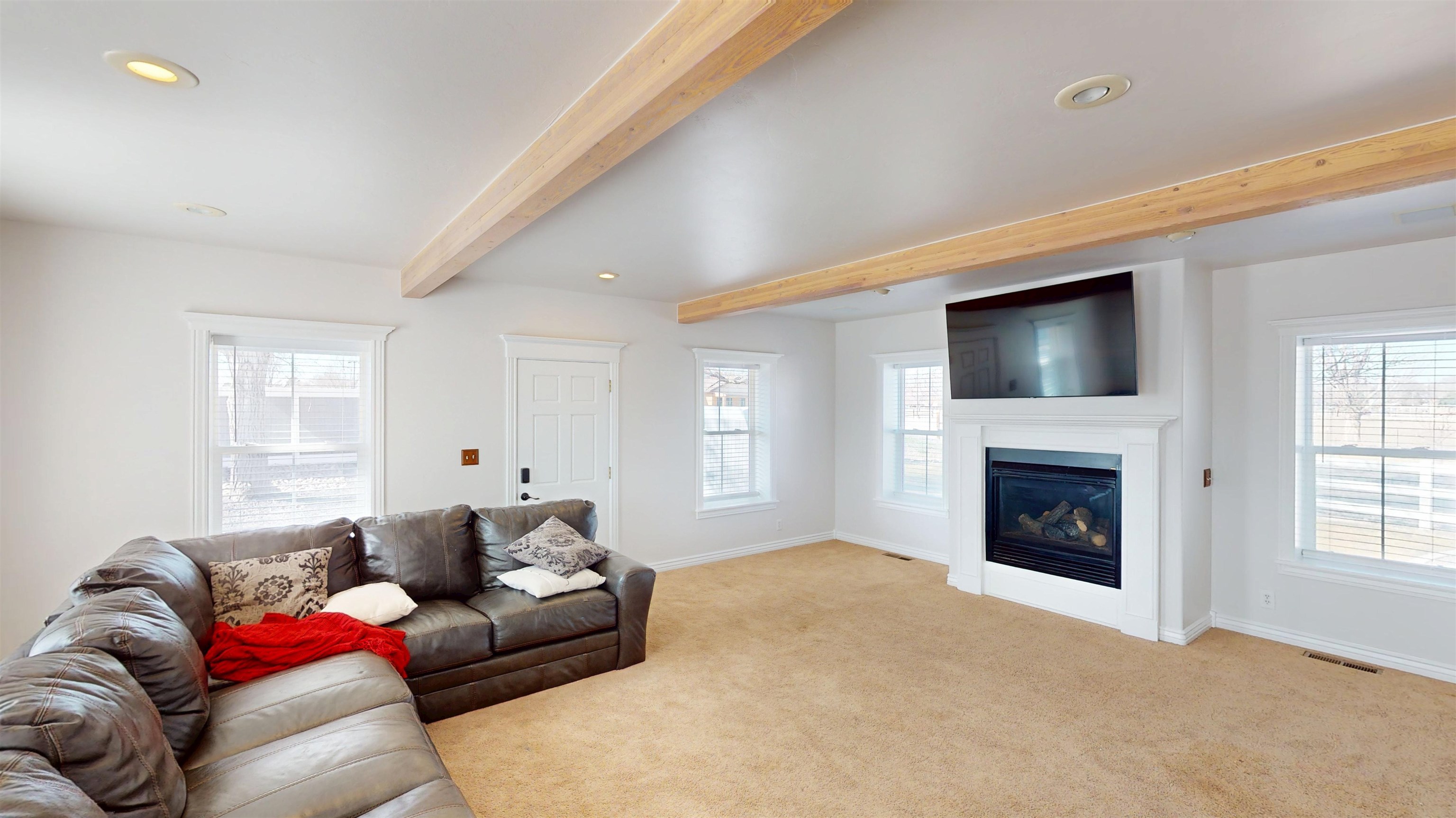 1166-17 17 1/2 Road Fruita, CO 81521 - Photo 7 of 42 a living room with furniture a fireplace and a flat screen tv