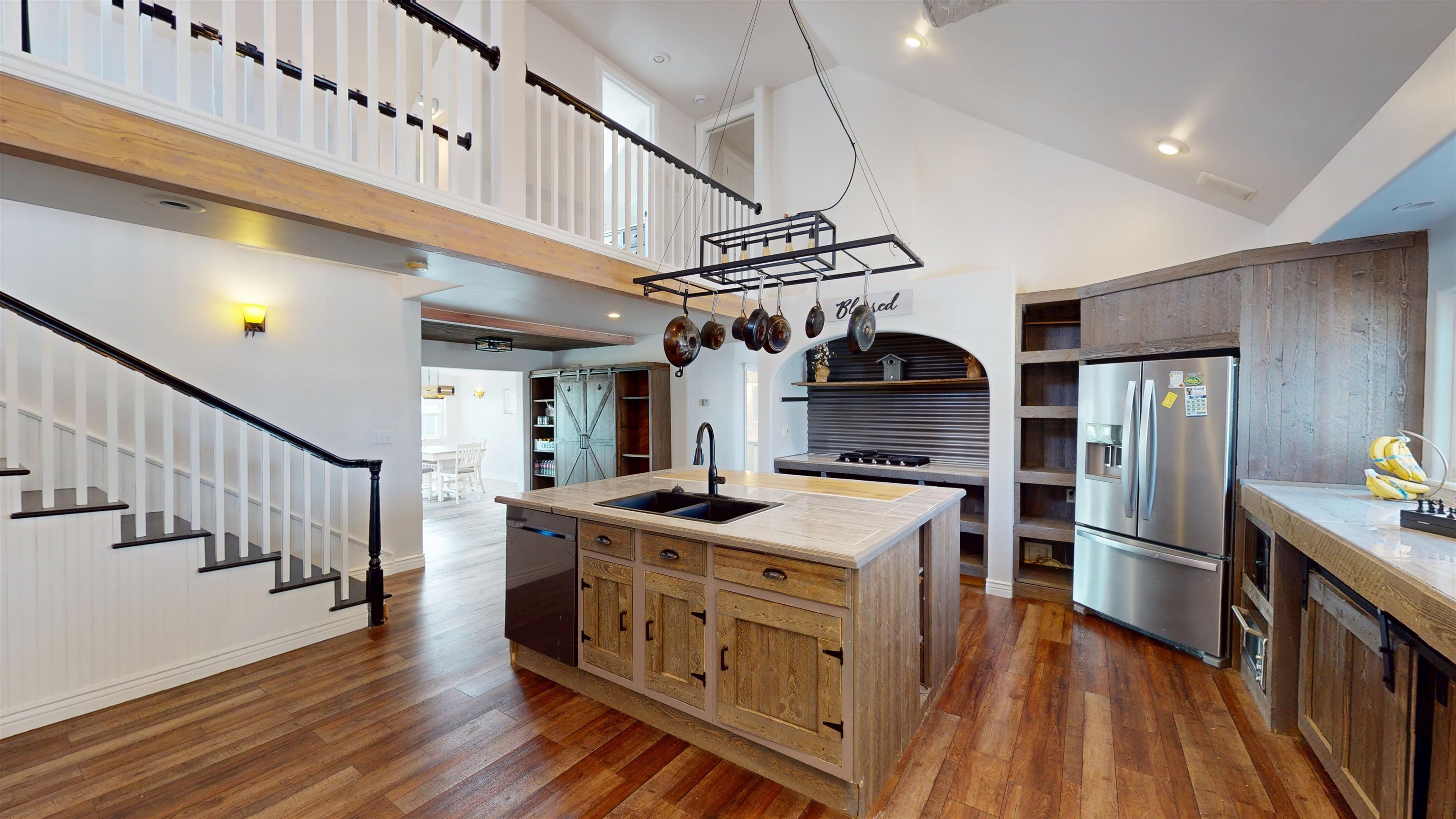 1166-17 17 1/2 Road Fruita, CO 81521 - Photo 10 of 42 a kitchen with stainless steel appliances granite countertop a kitchen island a stove and a wooden floors
