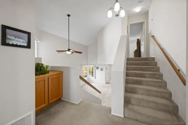 a view of a hallway with front door