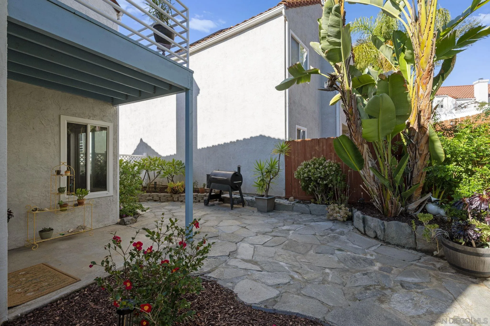 10503 Flora Azalea Court Santee, CA 92071 - Photo 29 of 33 a view of a chair and table in the patio next to a yard