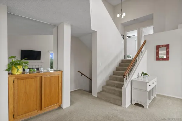 a view of a room with stairs and furniture