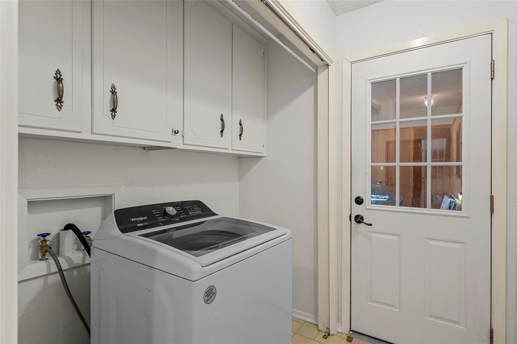 219 Opal Street Hewitt, TX 76643 - Photo 13 of 28 a utility room with dryer and washer