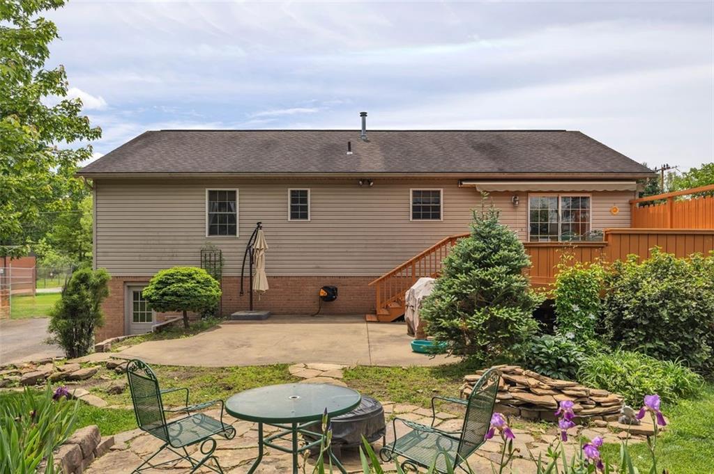 152 Cupps Road Renfrew, PA 16053 - Photo 6 of 43 a backyard of a house with barbeque oven table and chairs