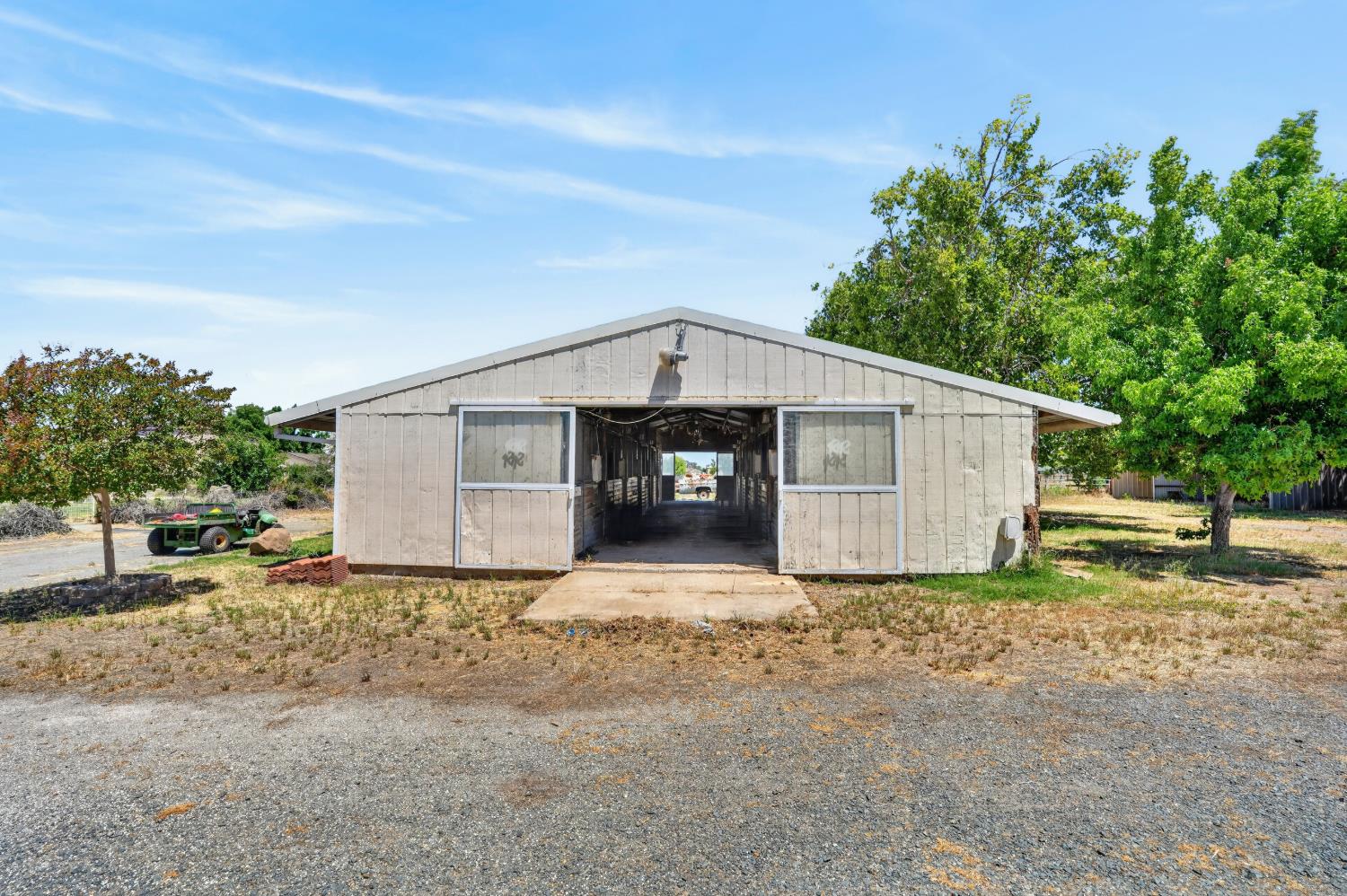 24390 North Jack Tone Road Acampo, CA 95220 - Photo 4 of 40 Show barn 10-12x12 stalls. Wash rack and tack room.