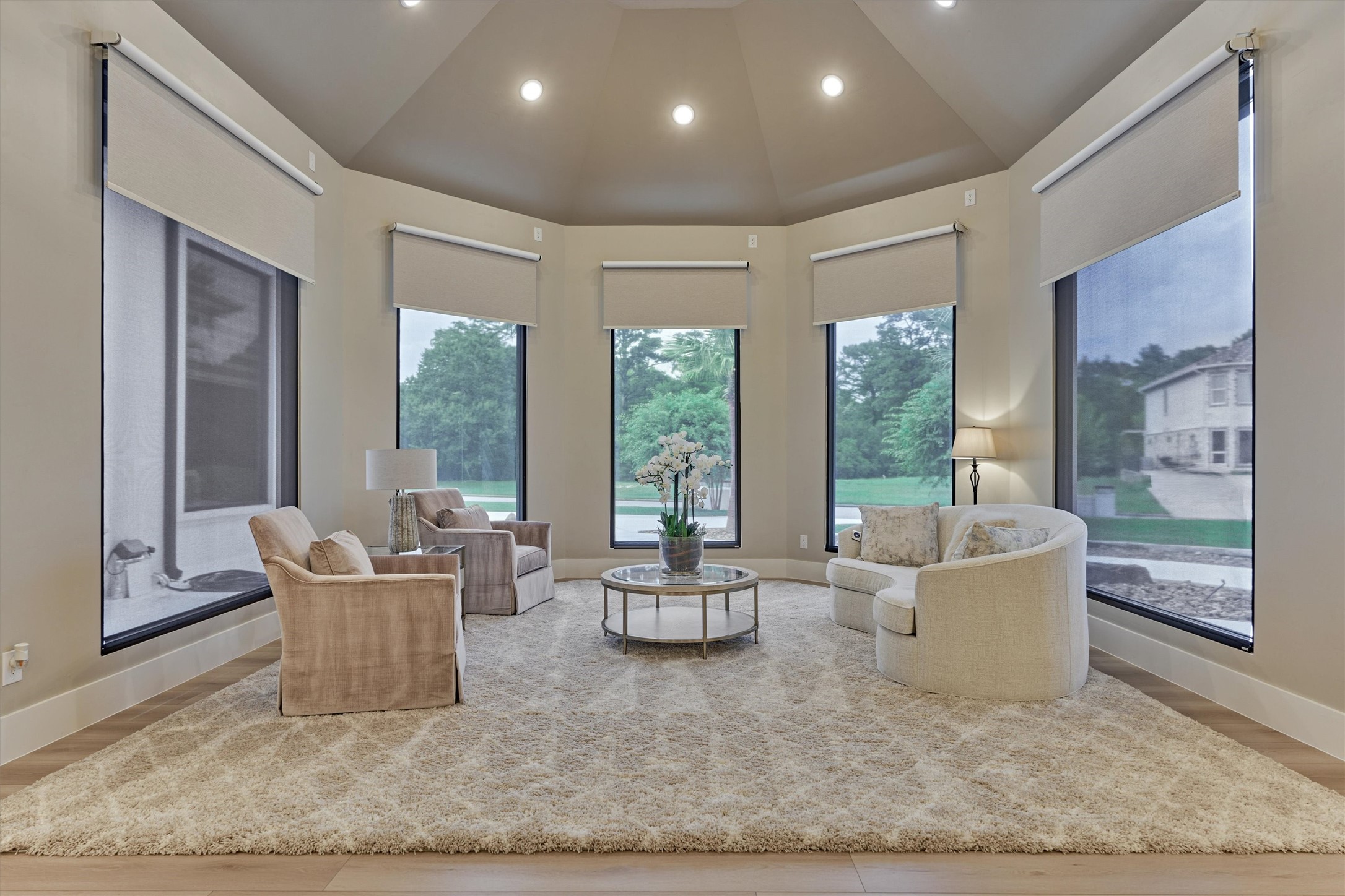 1907 Woerner Road Houston, TX 77090 - Photo 19 of 50 The sitting space in the primary offers panoramic views and soaring ceilings.