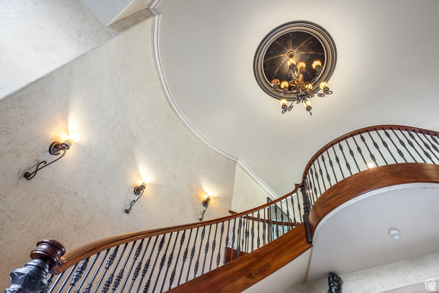 694 West Cephus Road Draper, UT 84020 - Photo 54 of 148 Grand curved staircase featuring hardwood banister with wrought iron balusters
