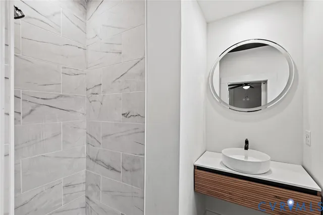 a bathroom with a sink and a mirror