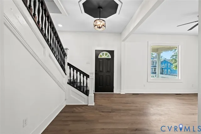 a view of entryway with wooden floor