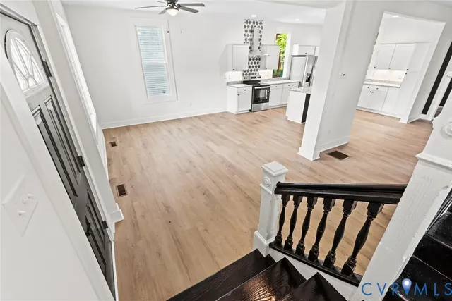 a view of a kitchen from a hallway