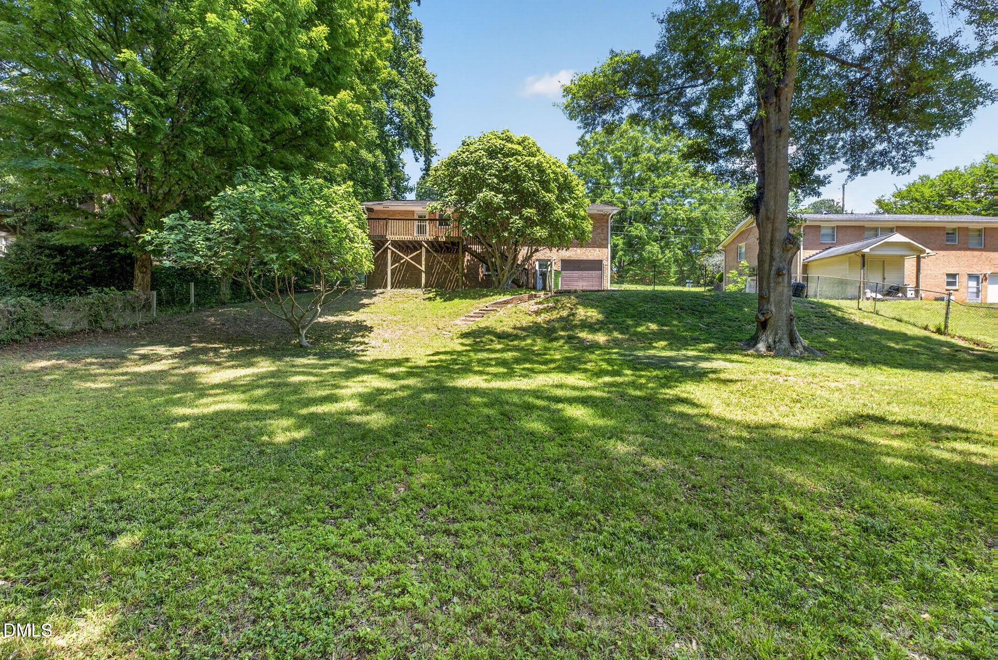1224 Pineview Drive Raleigh, NC 27606 - Photo 43 of 45 a view of a garden with a bench