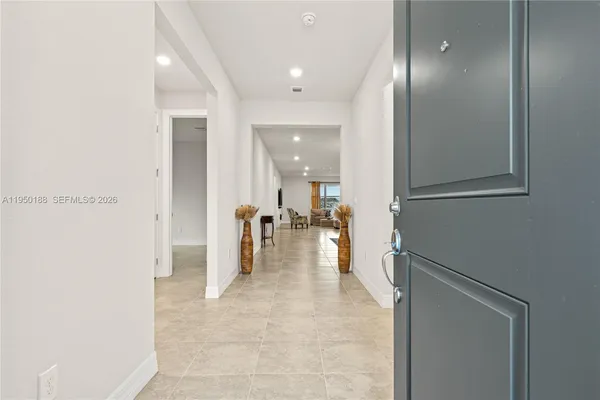 a kitchen with kitchen island cabinets a sink and a stove