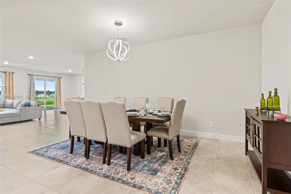 a kitchen with granite countertop kitchen island stainless steel appliances a sink and a counter top space
