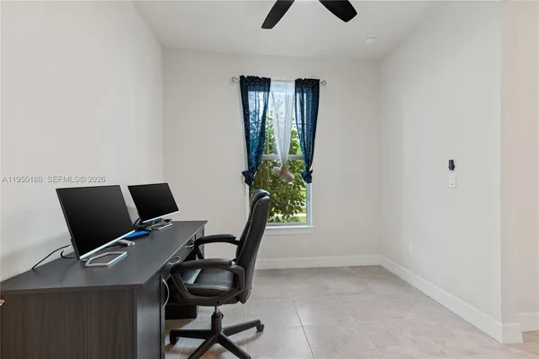 a kitchen with lots of clutter and cabinets