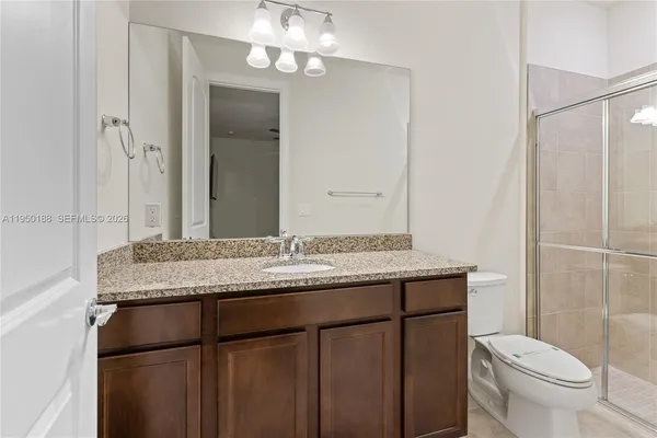 a white bath tub sitting next to a shower