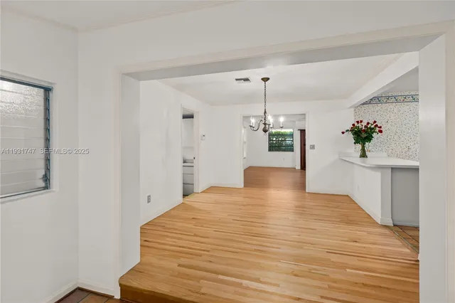 a view of an empty room and window