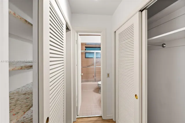 a view of a bathroom from a corridor