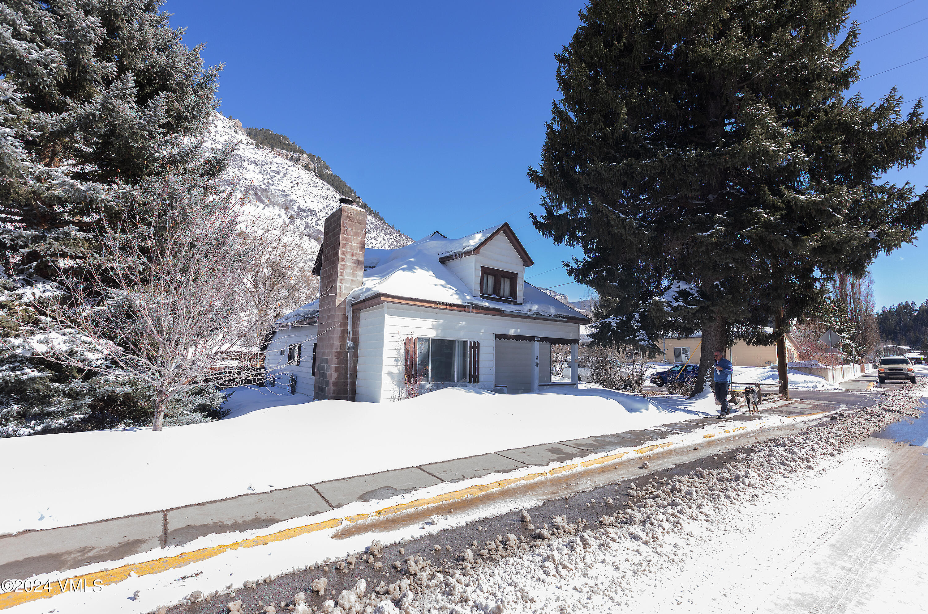 192 Main Street Minturn, CO 81645 - Photo 12 of 17 a view of a white house with a snow on the road