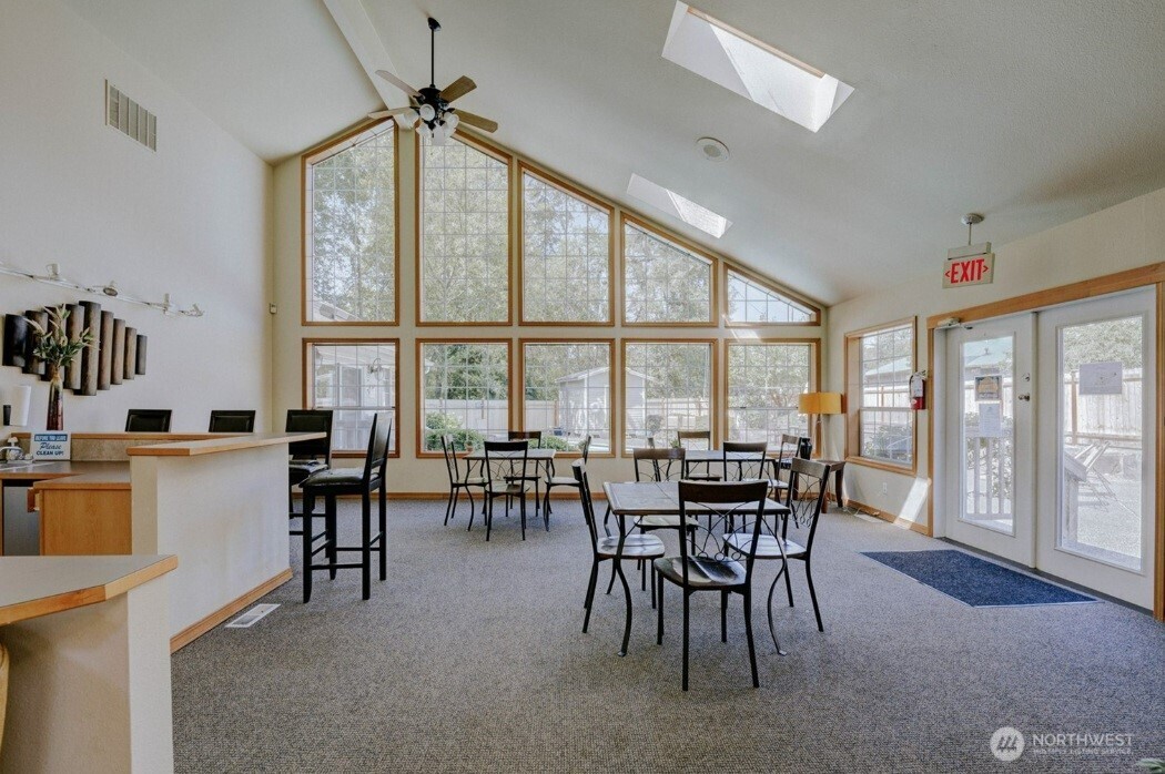 11527 Highway 99, Unit C102 Everett, WA 98204 - Photo 13 of 15 a view of a dining room with furniture window and outside view