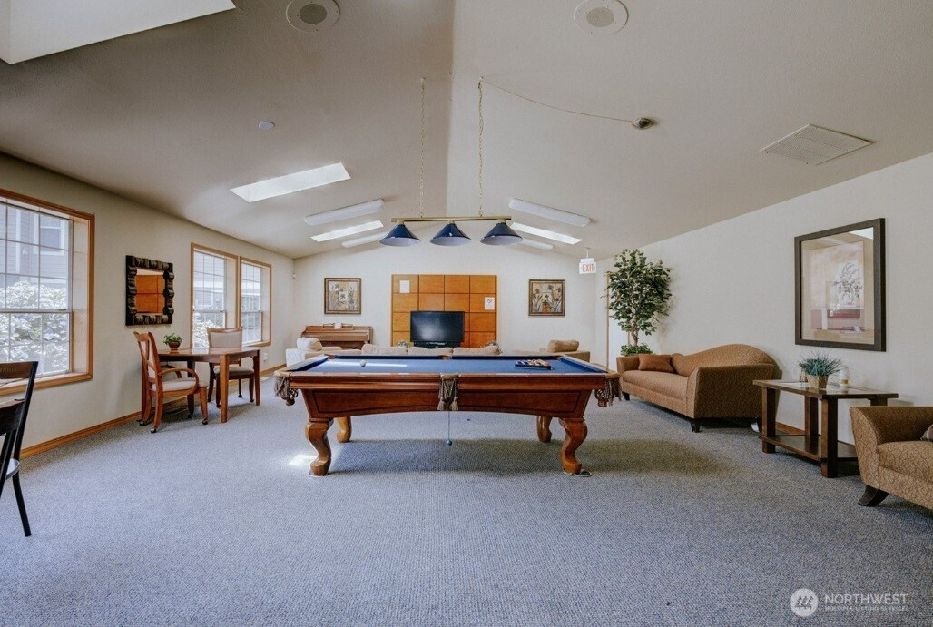 11527 Highway 99, Unit C102 Everett, WA 98204 - Photo 14 of 15 a living room with furniture and a table