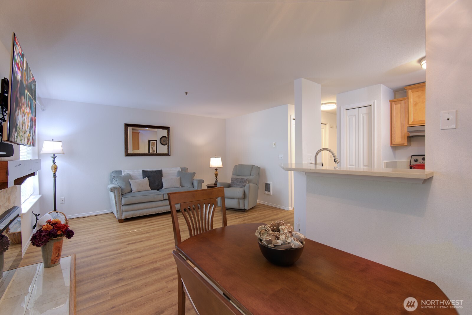 11527 Highway 99, Unit C102 Everett, WA 98204 - Photo 2 of 15 a living room with furniture and wooden floor