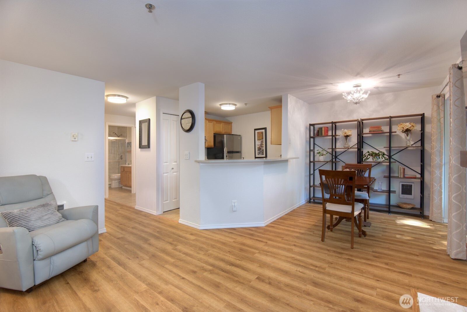 11527 Highway 99, Unit C102 Everett, WA 98204 - Photo 3 of 15 a living room with furniture and a wooden floor