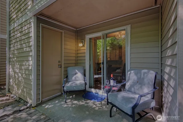 a outdoor living space with furniture and a potted plant